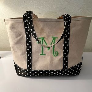 Canvas bag with “M” monogram and polka dot trim